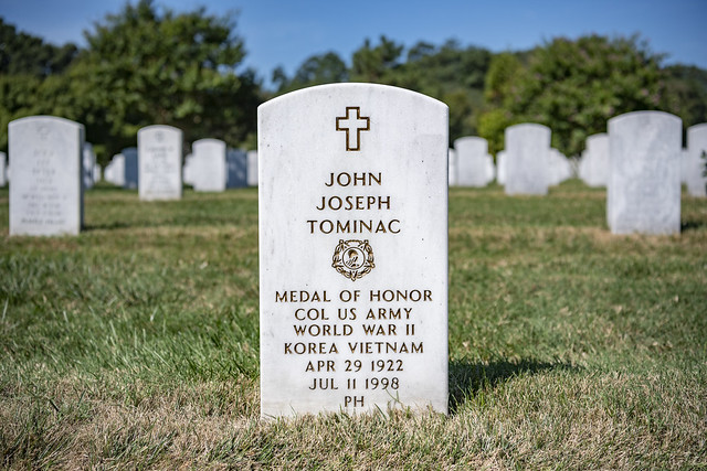 Grave marker for Army Colonel John Joseph Tominac, Medal of Honor recipient, World War II
