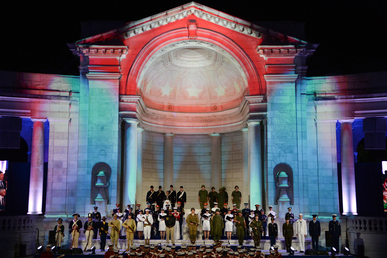 Memorial Amphitheater lit up for an evening performance celebrating Arlington National Cemetery's 150th anniversary