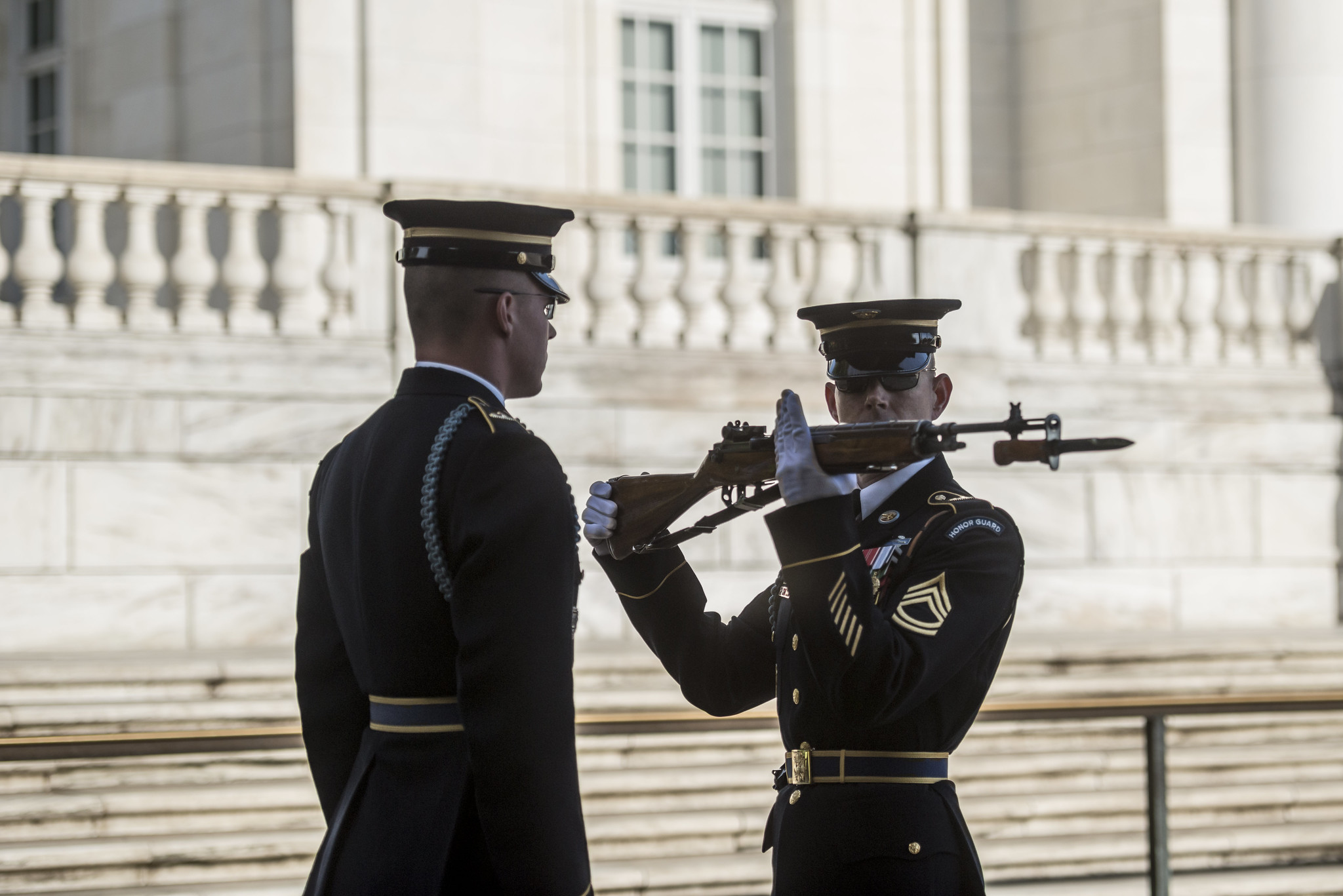 Two members of the 3rd U.S. Infantry Regiment (The Old Guard) participate in the changing of the guard at the Tomb of the Unknown Soldier