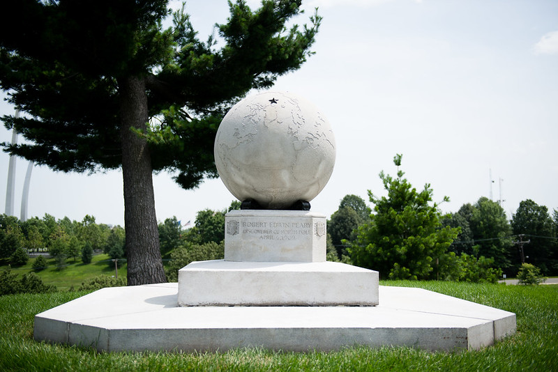 A large white marble globe marks the gravesite of North Pole explorer Robert Peary