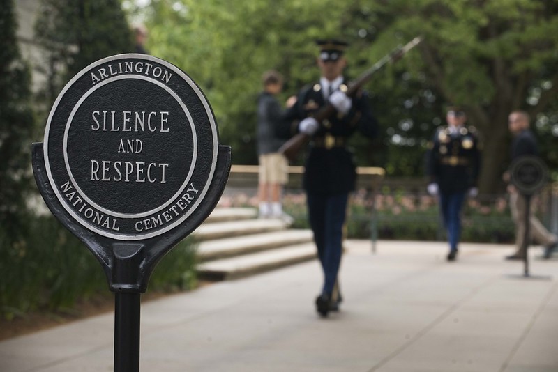 At the Tomb of the Unknown Soldier, a sign urges silence and respect